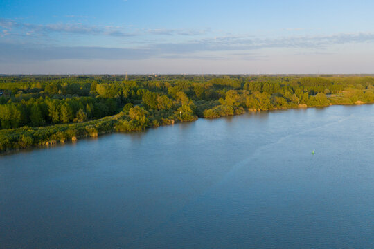 Aerial view of the Scheldt river, at sunset
