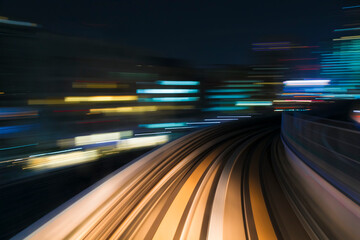 Speed and Motion - Riding on a Train through a Megacity at Night