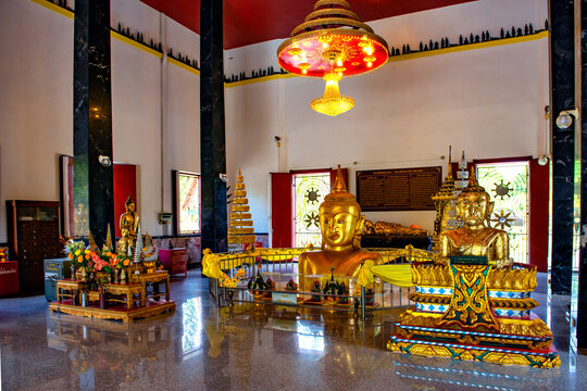 Thailand - April15, 2019 : Golden Buddha Statue Half-buried in ground of main chapel of Wat Phra Thong Temple, Thalang, Phuket
