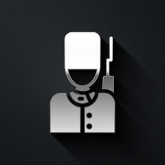 Silver British guardsman with bearskin hat marching icon isolated on black background. Long shadow style. Vector.