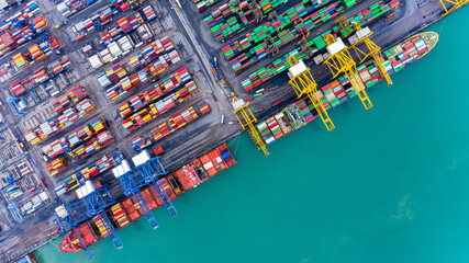 Aerial top view container ship at terminal seaport, Global business cargo freight ship import export logistic and transportation by container vessel ship company worldwide.