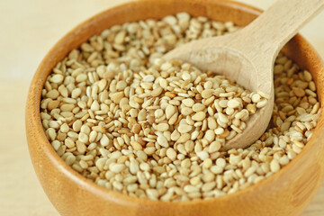 Close-up of sesame seeds in wooden bowl