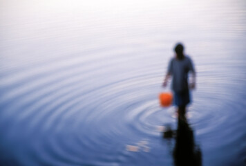 Boy seaching for Clams on Cape Cod Beach