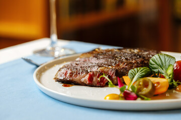Ribeye beef steak with fresh vegetable salad