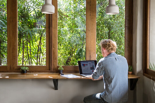 Young modern entrepreneur working on his laptop