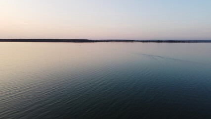 Fototapeta na wymiar Top view of a calm large forest lake