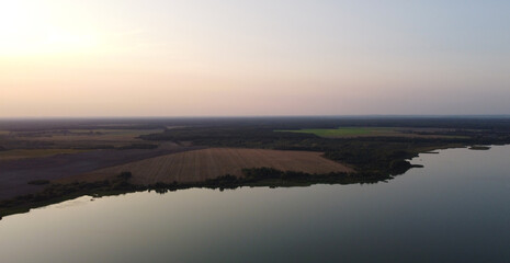 Top view of a calm large forest lake