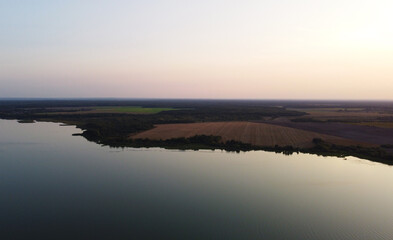 Top view of a calm large forest lake