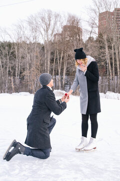 Young man offering his hand to his girlfriend
