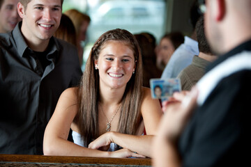 Bar: Bartender Examining Driver's License