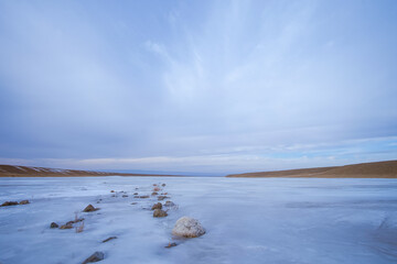 The frozen river Huren gol during winter in Govi-Altai province, Mongolia. - obrazy, fototapety, plakaty