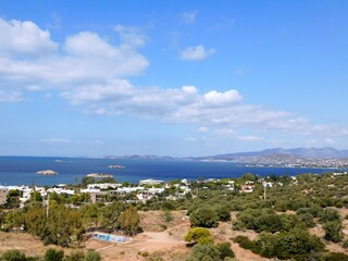 Fototapeta na wymiar Panoramic view of the coast and the Saronis town in Attica, Greece