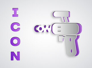 Paper cut Ray gun icon isolated on grey background. Laser weapon. Space blaster. Paper art style. Vector.