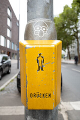 German traffic light button with ampfelman and graffiti 