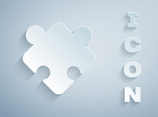 Paper cut Puzzle pieces toy icon isolated on grey background. Paper art style. Vector.