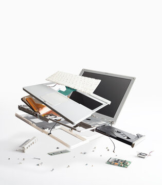 Disassembled White Laptop On The White Background