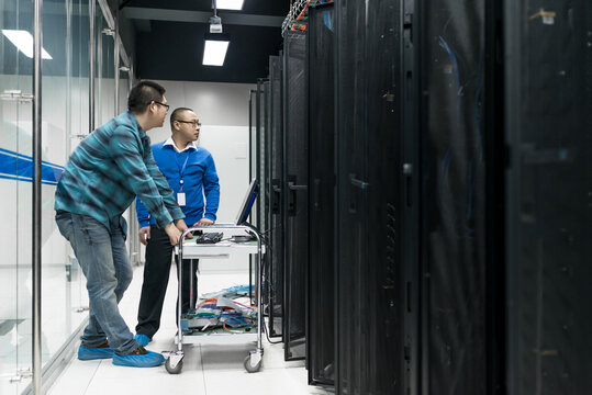 Young engineer working in datacenter