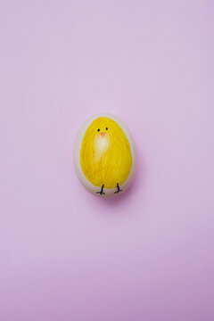 Decorated Easter egg on a pink background
