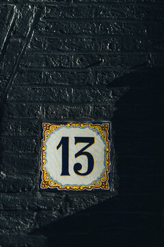 13 on a black wall