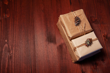 Three handmade paper boxes on wood with copy space on the right.