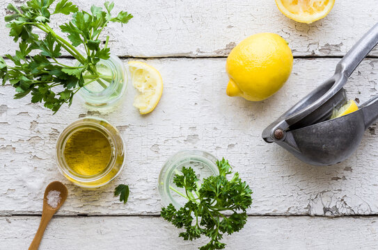 Greenery, lemon and olive oil from above