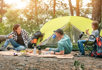 Family with dog during picnic in wood