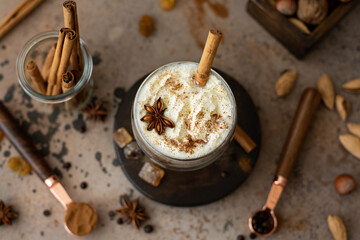 caffe latte with whipped cream, cinnamon and anise