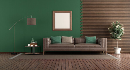Green living room with leather sofa