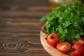 fresh basil with tomatoes and olives