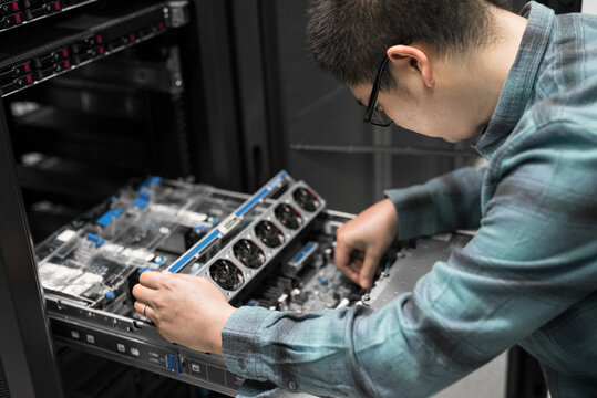 Young engineer working in datacenter
