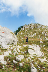 Fototapeta na wymiar Men hiking in mountains in a sunny day