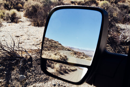 Reflection of Desert Landscape in Van Side Mirror