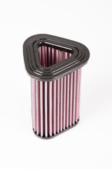 single triangular High performance motorbike air filter or for sport car on white background