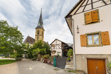 Fototapeta premium View on Eglise de Magstatt-le-Bas and timber framing house