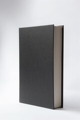 Black hardcover book with blank cover on white background