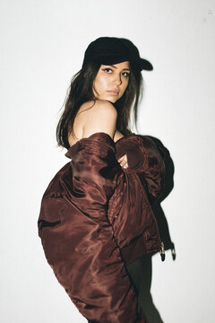 Woman in Hat & Bomber Jacket