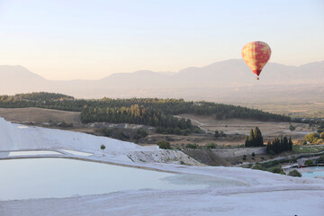 hot air balloon over Pamukkale travertines at sunrise turkey