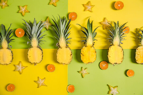 Pineapples in a row - tropical background