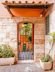 Fototapeta na wymiar vintage house front entrance metallic railings door, Rome Italy