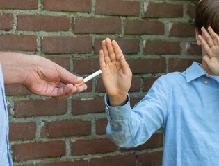 a boy refuse cigarette, say no to cigarette and drug concept