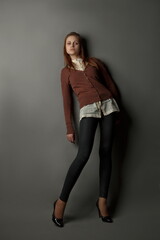 Young beautiful girl posing in studio