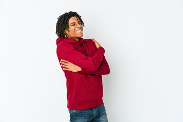 Young african american rasta man hugs, smiling carefree and happy.
