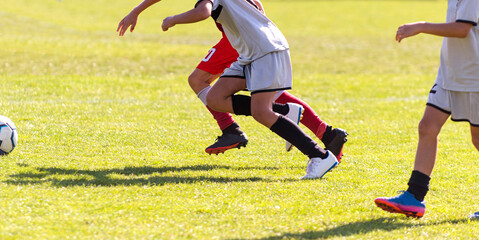 Obraz premium Boys play soccer sports field