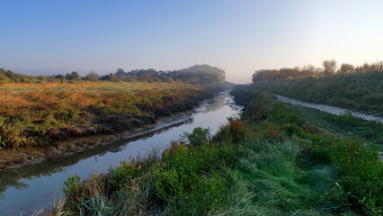 Sunrise and foggy morning on the Maye river. Bay of Somme