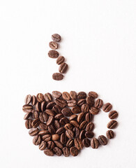 Coffee beans arranged in the shape of a coffee cup