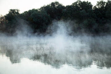 morning evaporation of water over the river, fog over the water