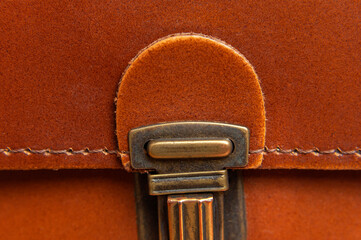 Fashionable brown women's bag made of genuine leather close-up. Leather bag texture. Fashion...