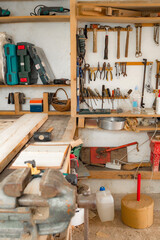 Various carpenter's tools and supplies in a garage.