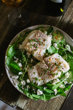 Halibut fillet with salad and Greek feta