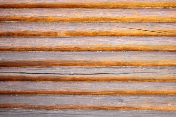 Brown wall as a background from wooden logs